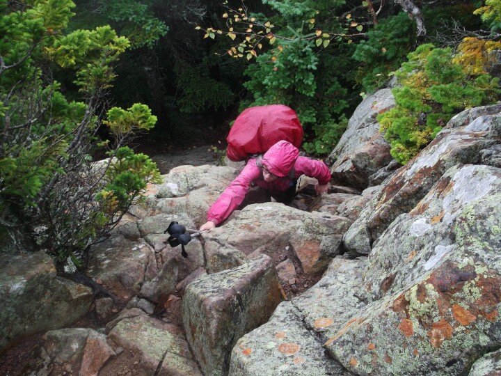 balancing on steep and rocky terrain